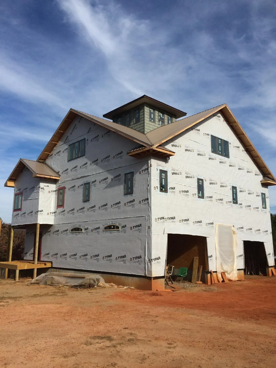 New two story house under construction with a cupola and gabled roofs in Port Elizabeth
